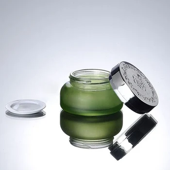 50 бр. е 30 грама на светло зелена стъклена банка за крем с блестящи сребристи ABS-капак, търговия на едро стъклена 30-граммовая козметична опаковка на крем за очи
